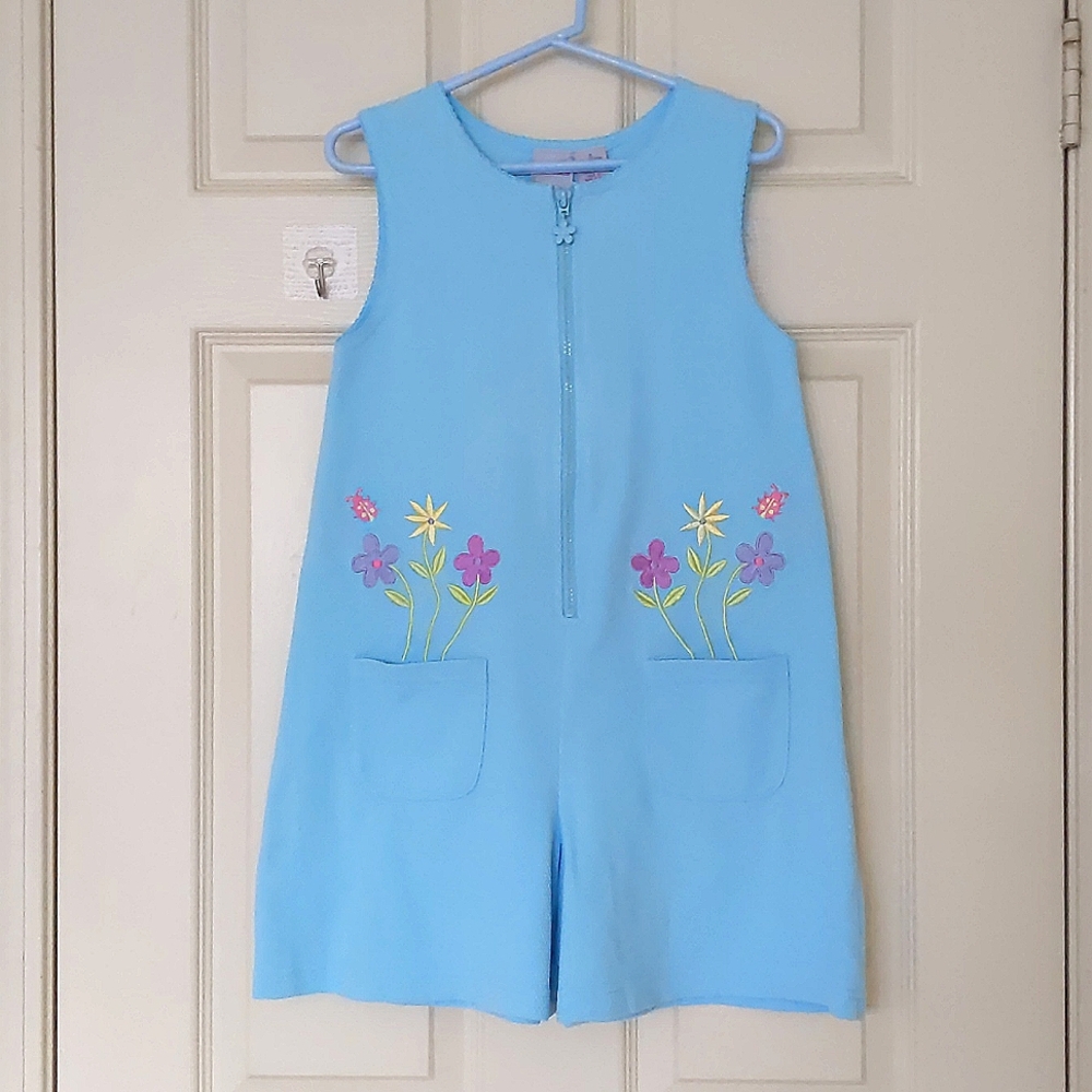 NWOT. Jumpsuits with multi color embroidered flowers and pockets.